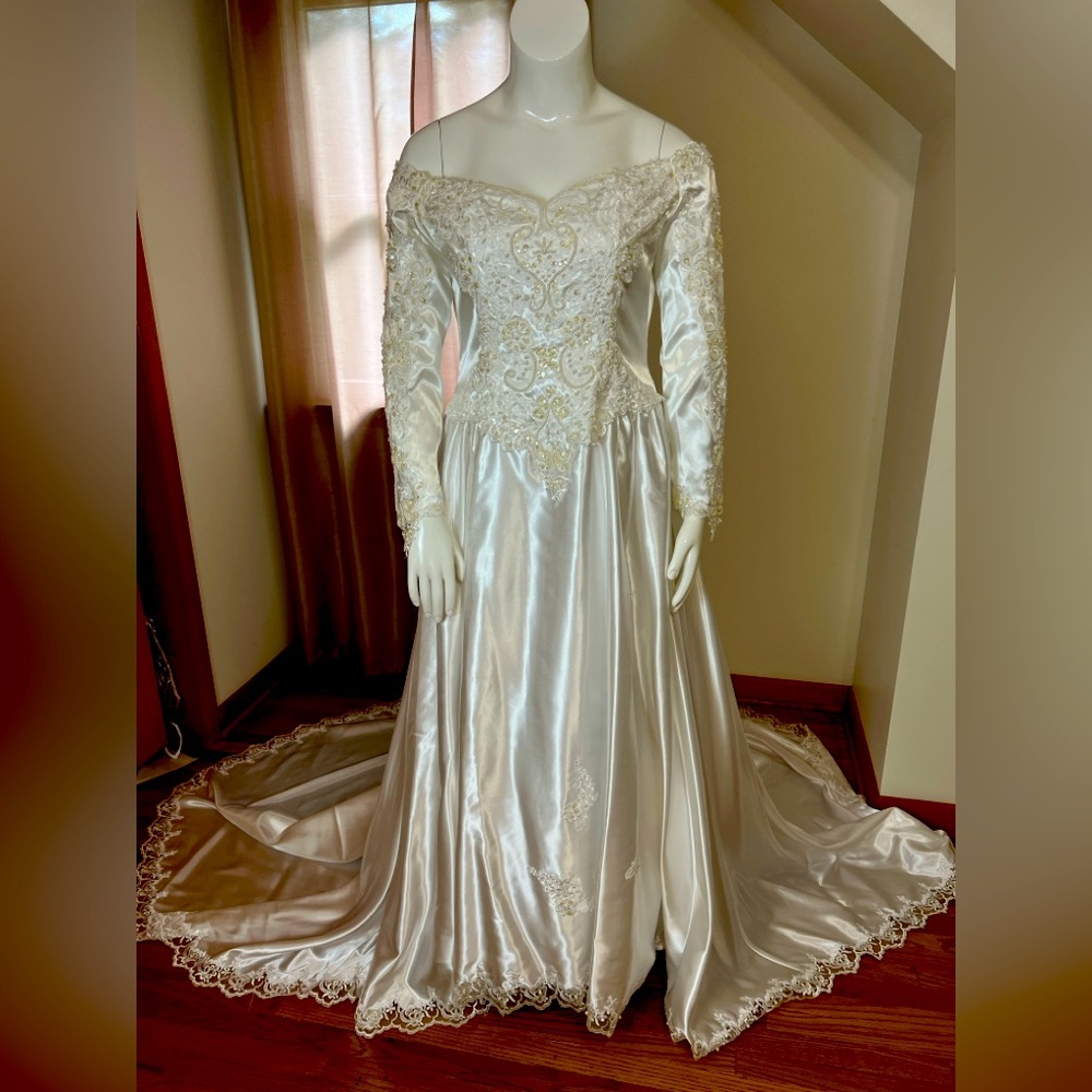 Vintage White Satin Bridal Gown with Pearl Details and cathedral length train.